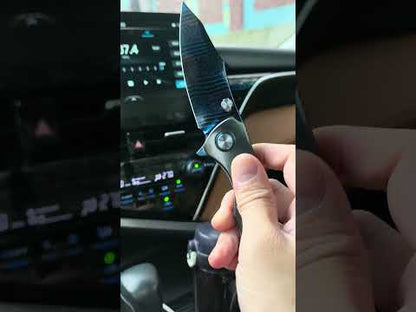 MFKNIFE Celestial Flame Folding Knife – Pattern-Welded Damascus-style Blade, Zirconium Handle KB023